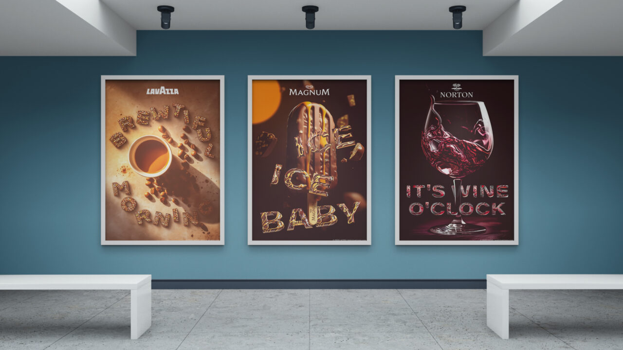 Three posters of iconic brands hanging on a blue wall in a gallery. On the left the logo of Lavazza, a cup of coffee seenfrom above and text made from coffee beans saying Brewtiful Morning. On the middle one the logo of Magnum Ice Cream, a chocolade ice on a stick with melted caramel running down on it and text made from chocolade and melted caramel saying Ice Ice Baby. On the right one the logo of Bodega Norton Winery, a glass of wine and text with wine effect saying It's Wine O'clock.